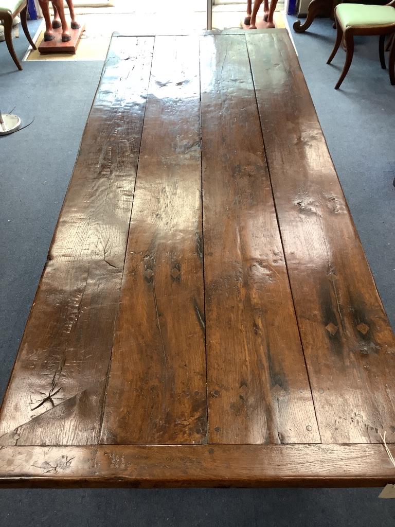 An 18th century style rectangular oak refectory dining table, length 221cm, depth 96cm, height 76cm